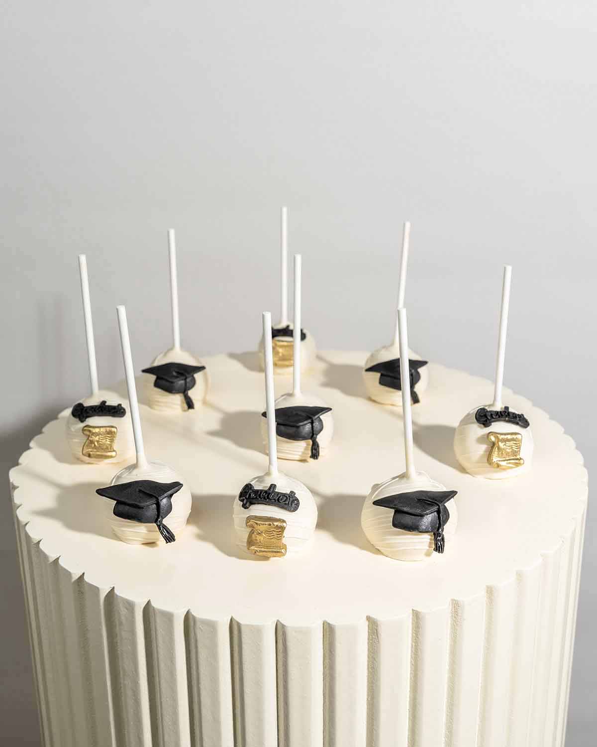 White Chocolate Graduation Cake Pops by NJD