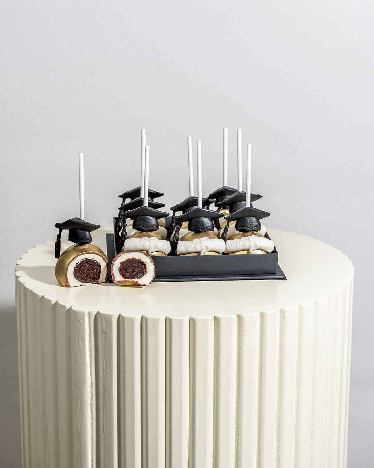 Graduation theme Chocolate Cake pops by NJD